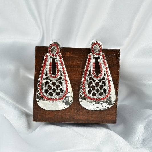 White Metal Earrings With Red Stones